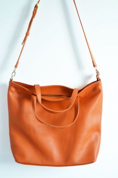 "Perfect Tote Bag Leather- ORANGE TOTE BAG, Full grain Leather Tote Express delivery by UPS for ONLY 15$ MORE! Please add your phone number for courier, in comment to order. 3-4 business days to US and Canada, 1-2 days in EU, 3-5 days worldwide. Regular shipping: 7-10 business days to US and Canada, 3-5 days in EU, 10-15 days worldwide. Simple and roomy tote bag made from high quality pebbled leather. This large tote bag is suitable for carrying everything in your everyday life. Spacious interio London Bag, Macbook Bag, Orange Tote Bags, London Bags, Large Leather Tote Bag, Oversized Bag, Women Leather Backpack, Large Leather Tote, Perfect Tote Bag