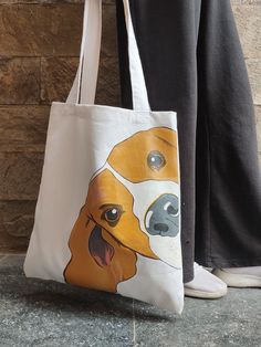 a person standing next to a bag with a dog on it