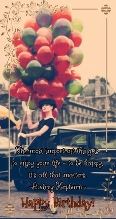 a woman with balloons on her head is sitting in the back of a car