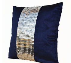 a blue pillow with sequins on it