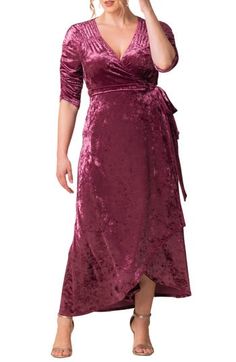 Shine through the upcoming party season in this elegant gown of shimmering crushed velvet in a choice of opulent jewel tones. Ruching along the yoke and sleeves adds a pretty touch to the flattering wrap style while the tulip-cut hem moves gracefully down the carpet. 62" length True-wrap style with side-tie closure Surplice V-neck Three-quarter sleeves Unlined 95% polyester, 5% spandex Dry clean Made in the USA of imported fabric Encore and Special Occasion Velvet Dress Wedding Guest, Plus Size Winter Dresses, Formal Plus Size, Velvet Dress Designs, Crushed Velvet Dress, Velvet Wrap Dress, Plus Size Winter, Velvet Maxi Dress, Velvet Gown