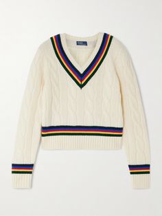 Polo Ralph Lauren’s V-neck sweater is a nod to classic cricket styles. It’s cable-knitted from wool and cashmere-blend and detailed with colorful stripes. Complete the preppy look with tailored trousers or a pleated mini skirt. Classic Half-zip Polo Sweater, Luxury Winter Cotton Polo Shirt, Luxury Solid Color Long Sleeve Polo Sweater, Luxury Polo Sweater With Seamless Collar, Luxury Polo Sweater With Collared Neckline For Work, Luxury Classic Polo Sweater With Seamless Collar, Luxury Half-zip Polo Sweater, Luxury Polo Sweater With Placket And Polo Collar, Cricket Jumper