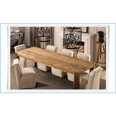 a large wooden table surrounded by white chairs in a living room with chandelier