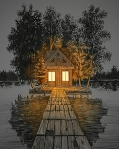 a house sitting on top of a body of water next to a wooden dock at night