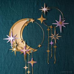 a crescent with stars hanging from it