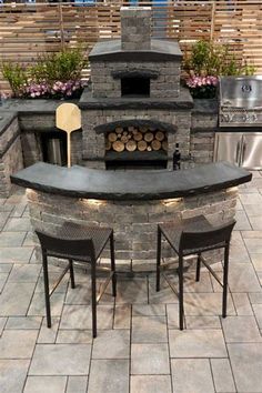 an outdoor pizza oven with chairs around it and a grill in the backround