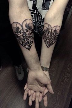 two people with matching tattoos on their arms