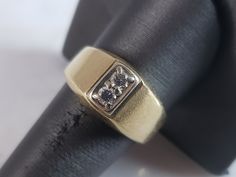 A MENS VINTAGE ESTATE 14K YELLOW GOLD BAND RING WITH .20cts OF DIAMONDS.  THE RING WEIGHS 9.8g. THE SIZE OF THE RING IS A 10.0.   RING IS MARKED ON THE INSIDE OF THE BAND.  THIS MAKES A LOVELY GIFT FOR THAT SOMEONE SPECIAL.  ANY QUESTIONS, PLEASE DO NOT HESITATE TO ASK. BE SURE TO CHECK OUT SOME OF MY OTHER GREAT ITEMS UP FOR SALE.  THANK YOU. Classic Yellow Gold Diamond Ring With Wide Band, Vintage Yellow Gold Rings With Diamond Accents, Collectible Yellow Gold Brilliant Cut Diamond Ring, Collectible Brilliant Cut Yellow Gold Diamond Ring, Collectible Yellow Gold Rings With Diamond Accents, Collectible Gold Rings With Diamond Accents, Wide Band 14k Stamped Ring For Anniversary, 14k Stamped Wide Band Ring For Anniversary, Antique Yellow Gold Diamond Ring With Vvs Clarity