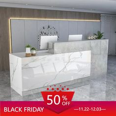 a white marble reception desk with the 50 % off sign on it for black friday