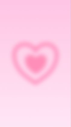 a pink background with a heart shaped shadow