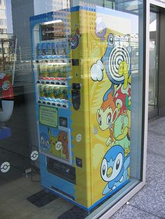 a vending machine sitting in front of a store window