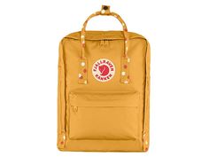 Fjallraven Kanken - Backpack Bags : Ochre/Confetti Pattern : Getting its start in 1978 among Swedish school children, the Fjällräven Kånken backpack has grown from a schoolyard staple to a fashion icon. The lightweight Kånken daypack is built on rugged Vinylon fabric, includes a comfortable foam back panel that doubles as a seat cushion, and has a simple-but-effective carry system that can be used as a tote or worn on the shoulders. Large main compartment to hold all your daily essentials. Front Mochila Fjallraven Kanken, Fjällräven Kånken, School Yard, Rain Cover, American Shirts, Kanken Backpack, Fjallraven Kanken, Fjallraven Kanken Backpack, Backpack Bags