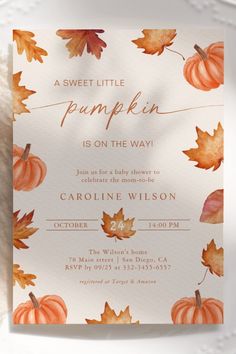 an autumn baby shower is shown with pumpkins and leaves on the watercolor paper