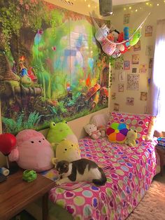 a cat laying on top of a bed in a room with stuffed animals and balloons