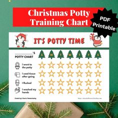 a christmas potty training chart is shown on a green background with gold stars and evergreens