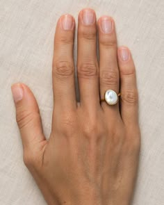 A gold statement ring with mother of pearl that is said to spark inspiration and intuition - you'll get a big dose of both with this mother of pearl ring.  The mother of pearl stone measures 12mm x 10mm.  Size: 4, 5, 6, 7, 8, 9, 10 Gold Mother Of Pearl Ring, Mother Of Pearl Rings, Big Pearl Ring, Pearl Wedding Ring, Natural Pearl Ring, Traditional Engagement, Mother Of Pearl Ring, Random Aesthetics, Pearl Rings