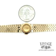 This polished, Vintage Ladies slide Rolex 18ky gold watch is a luxurious timepiece. Crafted with 18k yellow gold, this mechanical watch also features five different interchangeable Rolex watch bands so you can customize your look. Measuring 6.5” in length, it's a sophisticated addition to any collection. Vintage 18 karat yellow gold ladies Rolex mechanical watch 5 different interchangeable Rolex watch bands 6.5” in length Luxury Vintage Yellow Gold Watch, Elegant Yellow Gold Watch Accessories With Jubilee Bracelet, Elegant Yellow Gold Jubilee Watch Bracelet, Timeless Gold Watch Accessories With Diamond Hour Markers, Gold Watch Accessories With Diamond Hour Markers, Timeless Yellow Gold Polished Watch Bands, Timeless Yellow Gold Watch Bands With Polished Finish, Elegant Yellow Gold Self-winding Watch, Elegant Gold Self-winding Watches