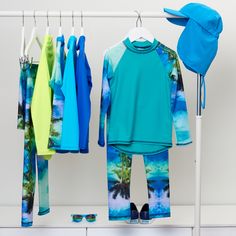 Our Tropical print is a favorite with our clients. There are so many items available in this print, ranging in sizes from 12 months up to 14-16Y Head over to our site now to check them all out! Tropical Horizon Long Sleeve Rash Guard #sunpoplife #sunprotectionclothing #rashguard #rashguards #sunprotectiveclothing #sunsafety #kidsrashguards #longsleeverashguards #kidsbeachwear #kidsswimwear #sunprotection Sun Protective Clothing, Protective Clothing, Kids Swimwear, Mock Neckline, Sun Rays, Kids Beachwear, Rash Guard, Tropical Print, Uv Rays