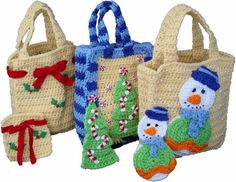 three knitted bags with snowmen and christmas decorations