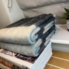 a stack of folded towels sitting on top of each other