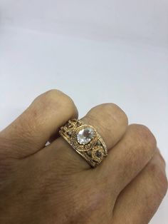 Small dainty white sapphire cocktail ring. Gold accented 925 Sterling Filigree Setting Size 7 Can be resized, my jeweler charges $10 All rings are shipped in a nice gift box. Check out our over a THOUSAND great reviews Engraving is $4 per letter and is not always perfect depending on the piece. It can take a few days if the jeweler is busy. This is payable to Paypal Judithsltd@gmail.com Anniversary Fine Jewelry Topaz Ring With Rose Cut Diamonds, Anniversary Topaz Ring With Rose Cut Diamonds, Heirloom Style Stackable Rings With Vvs Clarity For Gift, Luxury Stackable Rings With Rose Cut Diamonds For Gift, Luxury Topaz Ring With Rose Cut Diamonds Gift, White Stackable Rings With Diamond Accents For Gift, Heirloom Style Cubic Zirconia Stackable Rings For Gifts, White Stackable Rings With Diamond Accents As Gift, Heirloom White Topaz Rings In White