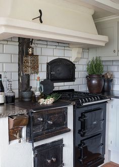 an old fashioned stove and oven in a kitchen