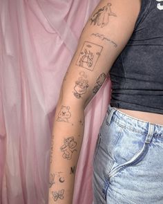 a woman's arm with tattoos on her left arm and right arm behind her