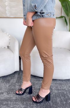 Feel on trendy with the Wren Pants! Featuring a smooth, faux leather material in a gorgeous tan color, a fun animal print throughout and a high-rise waistband with a straight leg style. Slip these on with a bodysuit or chunky sweater for a stunning holiday outfit! 55% PU, 40% Polyester, 5% Spandex Runs true to size, model wearing size Small High rise Slip on style Stright leg fit Fabric has stretch Lined Patterns may vary Colors may vary from different viewing devices Holiday Outfit, Chunky Sweater, Wren, Tan Color, Printed Leather, Holiday Outfits, Leather Material, Leather Pants, Animal Print