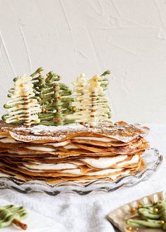 a stack of cookies with christmas trees on top