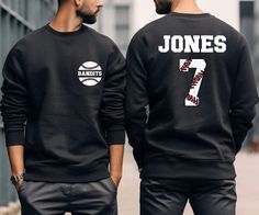 two men wearing sweatshirts with the number seven on them