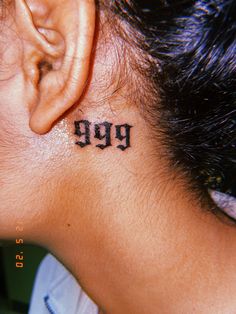 a woman with a tattoo on her neck has the word pee tattooed behind her ear