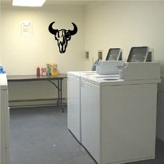 a laundry room with washer and dryer in it