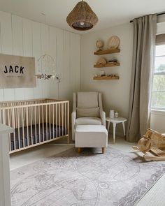 a baby's room with a crib, rocking chair and rug