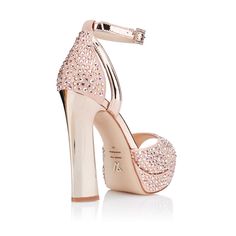 Description
Details
Shipping / Return




PINK METALLIC SUEDE SANDAL WITH SWAROVSKI CRYSTALS AND ROSE GOLD REVERSPECTIVE HEEL (13 CM)


A dazzling pink fantasy 

Charming, imposing and excessively feminine, our Pink Diamonds are one of the stars of our new Joya collection, inspired by the luxury of precious stones. In them, the romanticism of the pink tone of the metallic suede is filled with shine with dozens of Swarovski crystals that cover the entire piece for a model that shines with its ow Pink Glitter Party Sandals, Luxury Pink Sandals With 4-inch Heel, Glamorous Pink Sandals For Party, Pink Platform Heels For Wedding, Pink Sparkling Heels For Party, Glamorous Rose Gold Evening Sandals, Pink Sparkling Party Heels, Wedding Pink Sparkling Heels, Luxury Pink Sandals With Rhinestones