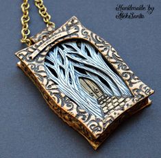 a necklace with a tree in it on a chain