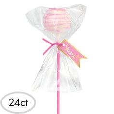 a pink lollipop wrapped in cellophane on a stick