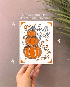 someone is holding up a card that says hello fall with orange pumpkins on it