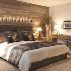 a large bed sitting next to a wooden wall