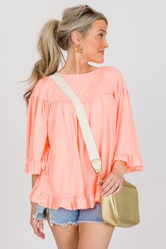 Now this is the kind of top we can get behind! It's made up of a stretchy knit material with a relaxed fit and a cute ruffle trimmed hem and sleeves. Raw edge detailing adds to the casual look. Knit Ruffle Top With Crew Neck, Knit Crew Neck Top With Ruffles, Knit Top With Ruffles And Crew Neck, Trendy Crew Neck Knit Top With Ruffles, Ruffle Hem And Sleeve Tops For Day Out, Ruffle Sleeve Tops With Ruffle Hem For Day Out, Ruffle Hem Tops With Ruffle Sleeves For Day Out, Stretch Knit Top With Ruffles Crew Neck, Stretch Crew Neck Knit Top With Ruffles