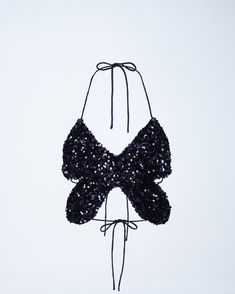 Pretty to see, hard to catch 🦋 This black butterfly top, made from sequin fabric and complete with a halter top style and tie back, will have them seeing stars in your eyes & your top 🤩 Party Season Sequined Halter Top, Summer Sequined Backless Halter Top, Sequined Backless Halter Top For Summer, Summer Party Sequined Halter Top, Sequin Halter Top For Summer Party, Backless Sequined Halter Top For Summer, Sequin Halter Top For Party Season, Chic Embellished Halter Top For Parties, Sequined Halter Top For Party