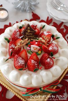 a white cake with strawberries and marshmallows on top