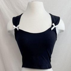 **Brand New*** Alanis Coquette Bow Top | Slip Into Playful Elegance With Our Alanis Coquette Bow Top! The Cropped Sleeveless Design Features Charming Ribbon Detailing On The Side, Adding A Touch Of Coquettish Flair. Perfect For A Night Out Or A Fun Day With Friends. Brand: Black + Moon Available In Sizes S & L Sleeveless Ribbon Bow Details Cropped Stretchy Imported 97% Cotton, 3% Polyester True To Size Cute Black Crop Top For Summer, Cute Black Summer Crop Top, Black Crop Top With Straps For Summer, Black Strap Crop Top For Summer, Cute Sleeveless Crop Top For Parties, Coquette Top, Moon Top, Coquette Fashion, Day With Friends