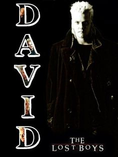 the lost boys movie poster with david david in black jacket and white hair, standing against a dark background