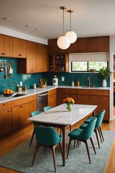 a kitchen with wooden cabinets and blue chairs around a white marble table surrounded by green tile backsplash