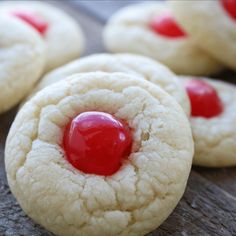 some cookies with jelly on them sitting on a table