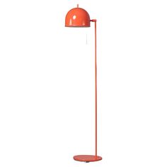 an orange floor lamp on a white background