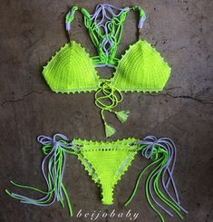 two pieces of neon green crochet bikinisuits with tassels on the sides