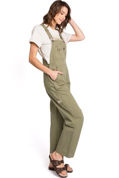 Lightweight, chino overalls with a 90s retro, straight-leg silhouette. Functional, multi-pocket bib with traditional straps. High rise, rigid waist fit with button closures on both sides and classic 5-pocket design. CARE | Machine Wash Cold Inside Out CONTENTS | 100% Cotton MEASUREMENTS | 56"/142 cm Top to Bottom 30"/77 cm Inseam (Size Small) MODEL | 5'7/110 lbs - wearing a size Small in BLACK; 5'8/115 lbs wearing XS in GREEN & SAND IMPORTED/CHINA 115 Lbs, Green Sand, 110 Lbs, 90s Retro, Narcissism, Pocket Design, Inside Out, Overalls