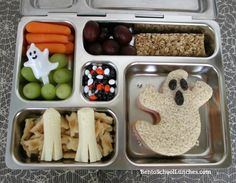 a bento box filled with different types of food and snacks to eat for halloween