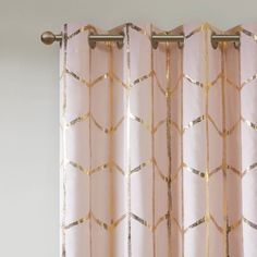 a curtain with gold foil on it in front of a window